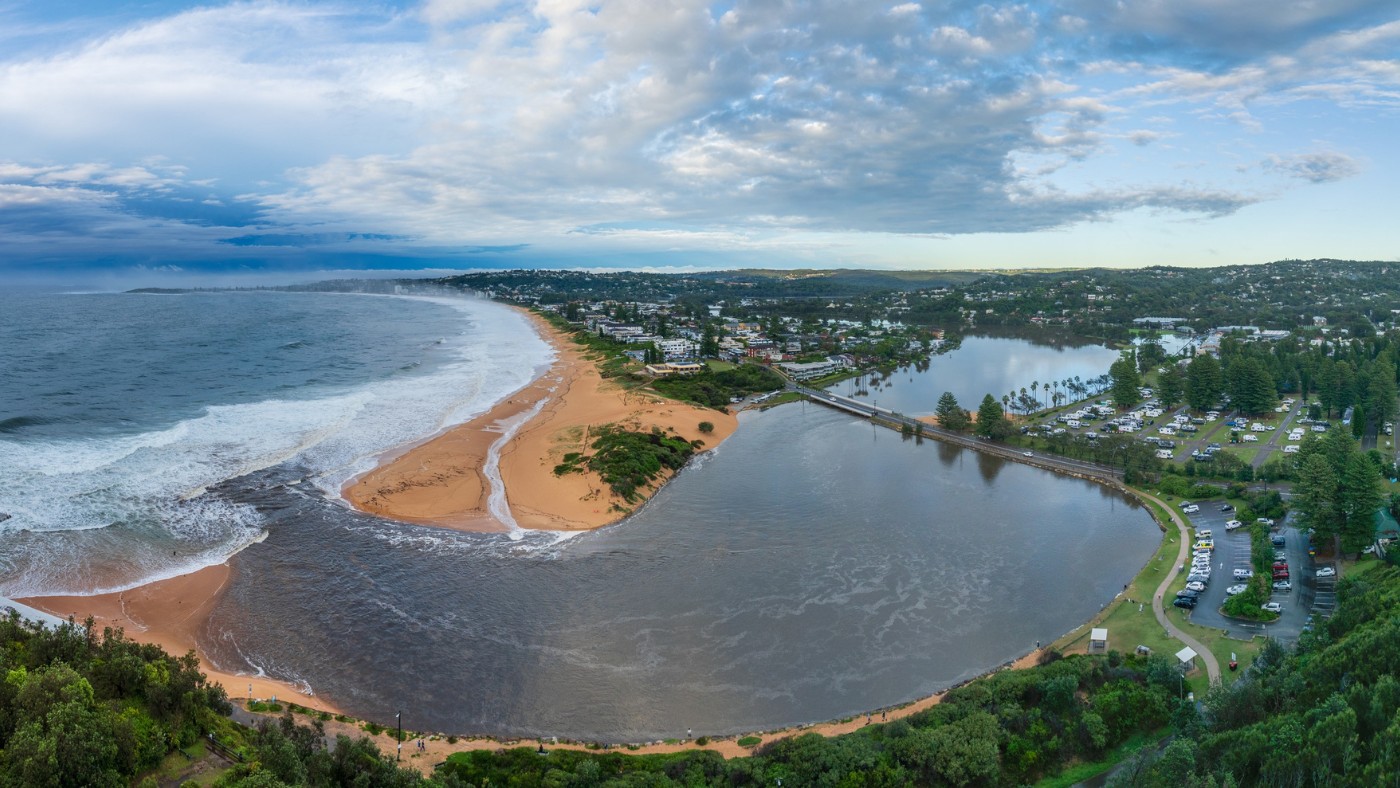 Aerial view of the Narrabeen Lagoon meeting the ocean in Narrabeen, NSW.