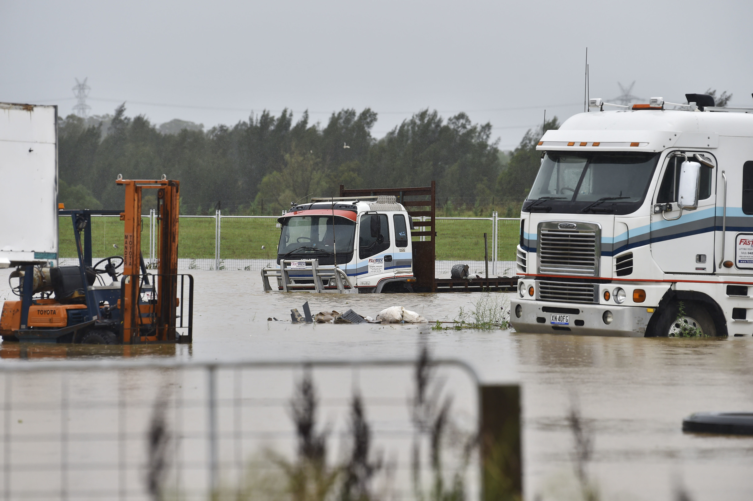 Stranded trucks in floodwater 9 Feb 2020 photo by Adam Hollingworth